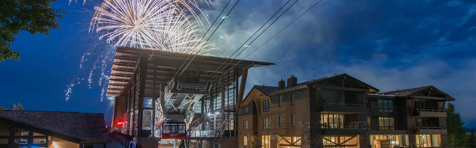 Fireworks explode in the night sky behind the Jackson Hole Aerial Tram in Teton Village, WY.